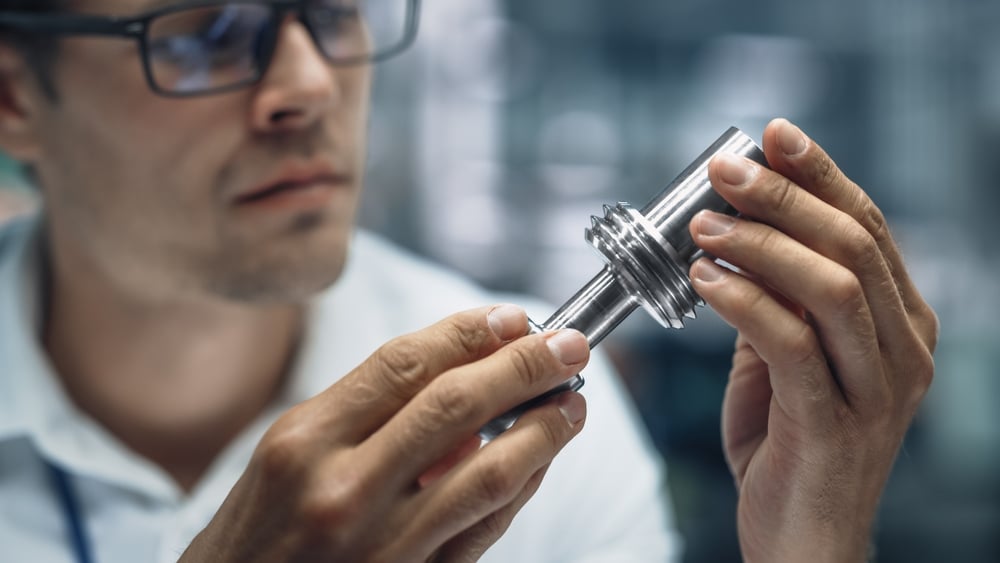 Engineer working with metal